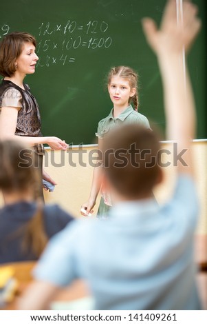 School kids in classroom at math lesson