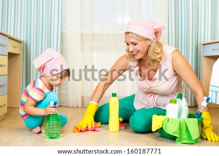 mother and kid cleaning room