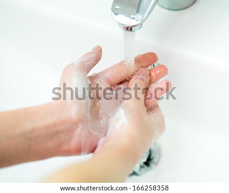 Washing Of Hands With Soap In Bathroom Close Up
