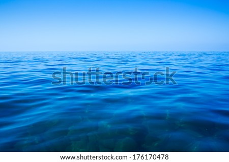Calm sea and blue clear sky in summer day