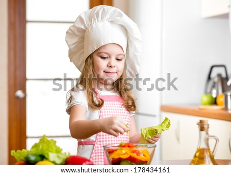 cute girl preparing healthy food vegetable salad
