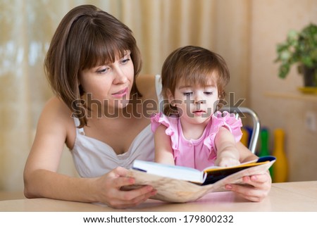 mom and kid read a book