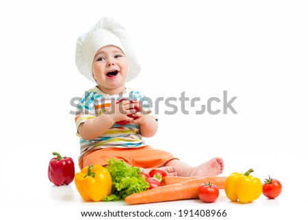 baby chef with healthy  food vegetables
