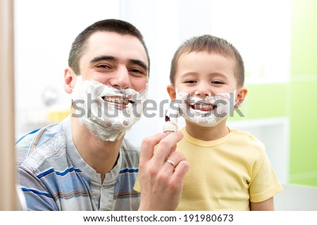 Father teaching his son boy how to shave