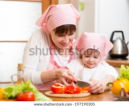 mom and kid girl preparing healthy food