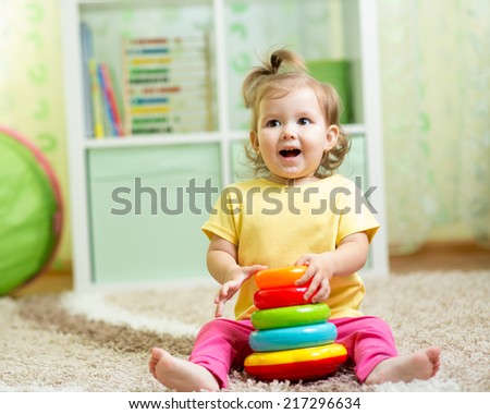 funny child playing with toy indoor