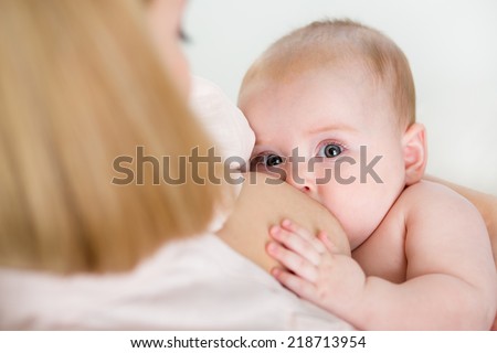 mother breastfeeding her baby girl mother breastfeeding her baby girl