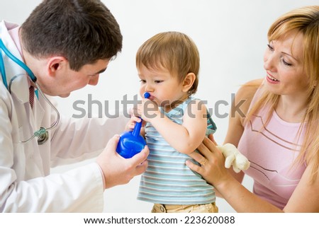 doctor counselling mother and kid about nasal irrigation or douche with neti pot