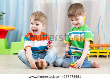 kids boys brothers with educational toy in playroom