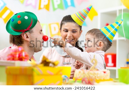 parents have fun celebrating birthday of his kid son