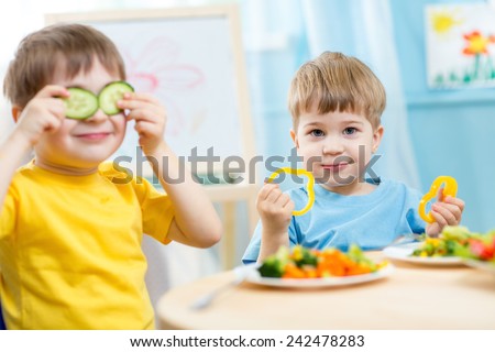kids eating healthy food in kindergarten or at home