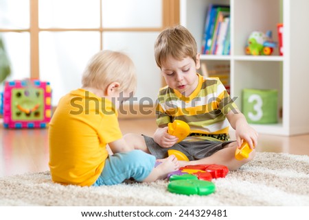 children play with educational toy in nursery