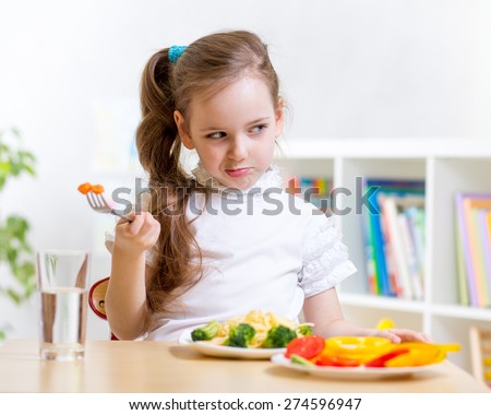 kid girl refuses to eat healthy food
