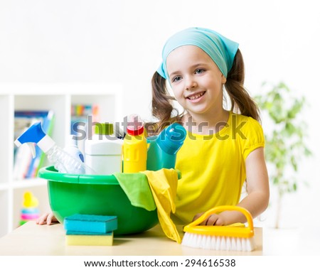 child girl with cleaning tools