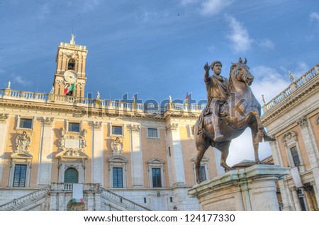 Horse sculpture of the emperor Marcus Aurelius with the Capitol Museum at the background in Rome, Italy
