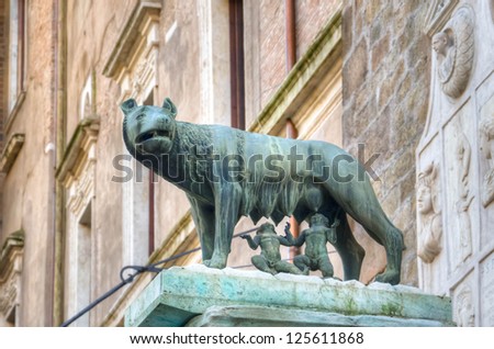 Brass sculpture of Romulus and Remus drinking milk from the female wolf in Piazza del Campidoglio in Rome, Italy