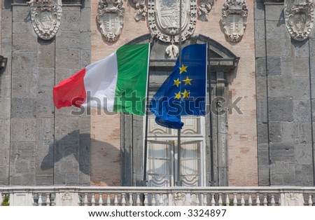 Flags of Italy and Europe in front of a building