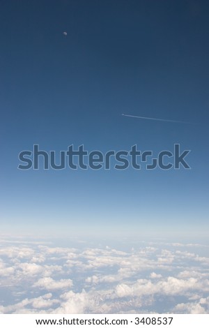 Flying Plane with Moon in the Background
