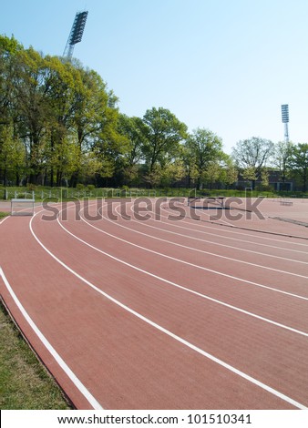 summer athletic stadium with run race tracks and light masts