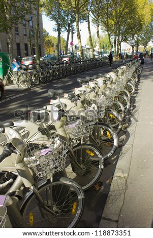 Public bike rental station on Paris alley