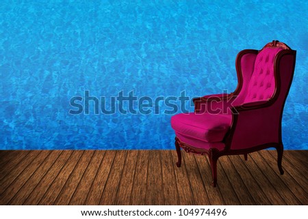 High resolution creative wood floor with vintage armchair and swimming pool background