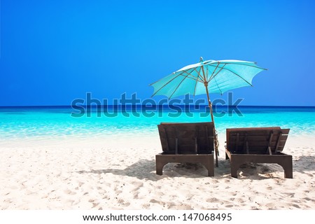 Beach Chairs With Umbrella And Beautiful Sand Beach