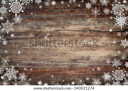 Christmas background with snowflakes and wooden texture