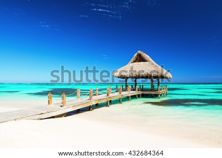Beautiful gazebo on the tropical white sandy beach in Punta Cana, Dominican Republic