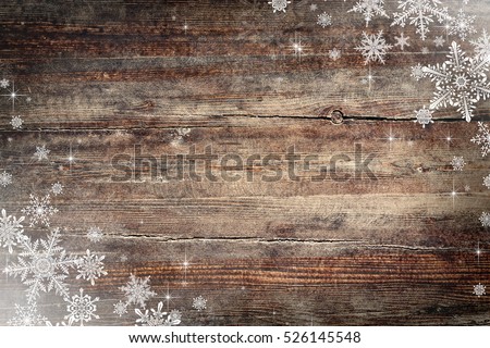 Christmas background with snowflakes on wooden texture