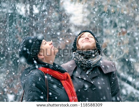 Two Happy female in Winter Park enjoying in the snow.Family Outdoors