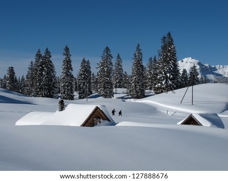 Winter scene in Toggenburg, huts and trees, snow