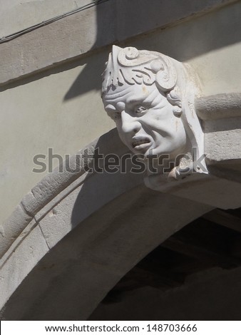 Unhappy face, detail of a Renaissance facade in Treviso, Italy.