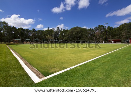 Green bowls or lawn bowls player ground which is natural grass or artificial turf surrounded with spot light, scorecard etc.
