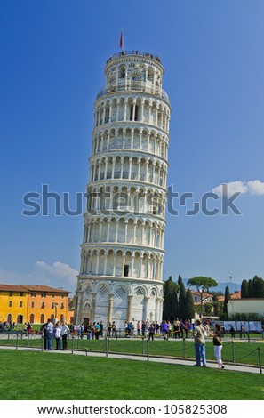 PISA, ITALY - MARCH 26: Tourists visit leaning tower in Pisa, Italy on March 26, 2012. It is one of the main centers for medieval art and Unesco World Heritage symbol