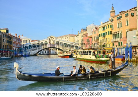 VENICE, ITALY - MARCH 28:Gondola at Rialto Bridge on March 28, 2012 in Venice, Italy. There were several thousand gondolas in the 18th century, with only several hundred today for tourism.