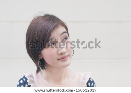 Beautiful thoughtful woman looking up-close up