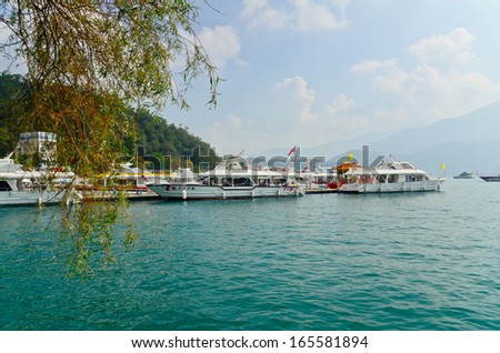 SUN MOON LAKE - OCT 25: many boats parking at the pier on October 25, 2013 at Sun Moon Lake, Taiwan. Sun Moon Lake is the largest body of water in Taiwan as well as a tourist attraction.