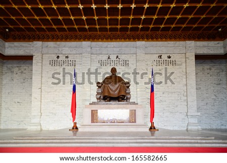 TAIPEI, TAIWAN - OCT 22: A large bronze statue of Chiang Kai-shek on October 22, 2013 in Taipei, Taiwan. This huge bronze statue dominates the main hall of the CKS memorial hall in Taipei, Taiwan.