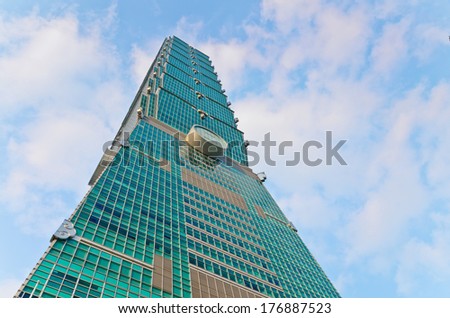 TAIPEI, TAIWAN - OCT 26 : A view to Taipei 101 from busy corner in Xinyi financial district of Taipei city October 26, 2013 in Taipei, TW. The building is the world\'s second tallest at 509 meters.