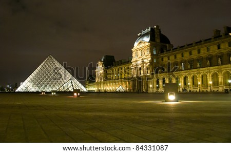 PARIS - MARCH 20: Louvre Pyramid shines at night during the winter March 20, 2008 in Paris. Louvre is the biggest Museum in Paris displaying over 60,000 square meters of exhibition space.