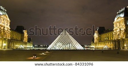 PARIS - MARCH 20: Louvre Pyramid shines at night during the winter March 20, 2008 in Paris. Louvre is the biggest Museum in Paris displaying over 60,000 square meters of exhibition space.