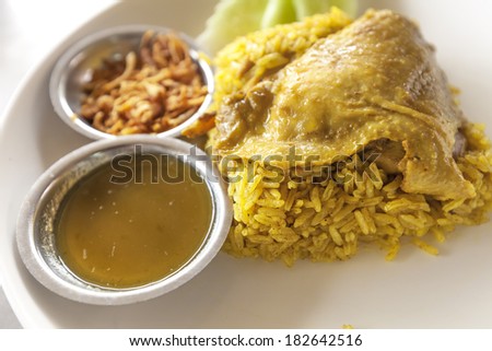 close up fried rice with yellow ginger with chicken, Thai food on white dish