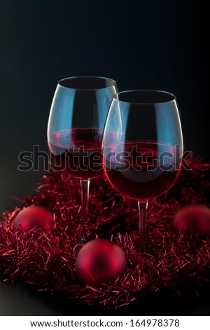 Holiday background with glass of red wine.Christmas decoration set.