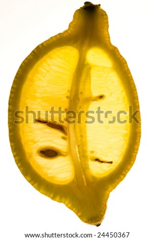 Slice of lemon with back light with seeds