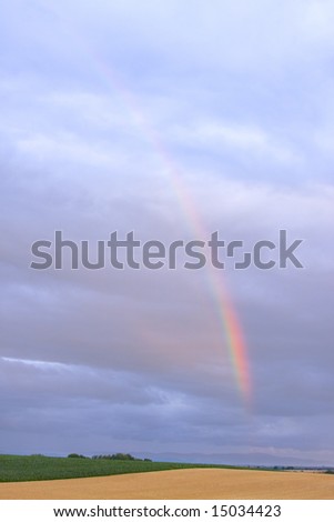 Colourful rainbow in a cloudy sky