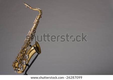 Tenor Saxophone against a gray studio background