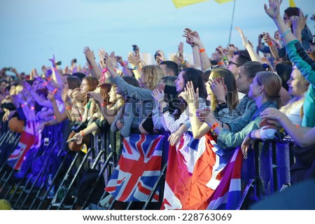 MINSK, BELARUS - JULY 03: People crowd with british flags during \'Most festival\' on July 3, 2014 in Milnsk, Belarus.