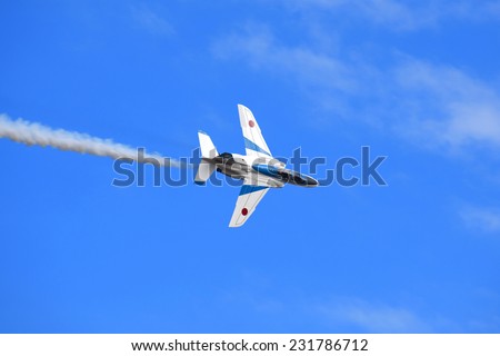 SAITAMA, JAPAN - NOVEMBER 3, 2014: Japanese Air Self-Defense Force holds their annual airshow at their Iruma airbase. They have a demonstration flight by an aerobatic team called Blue Impulse.