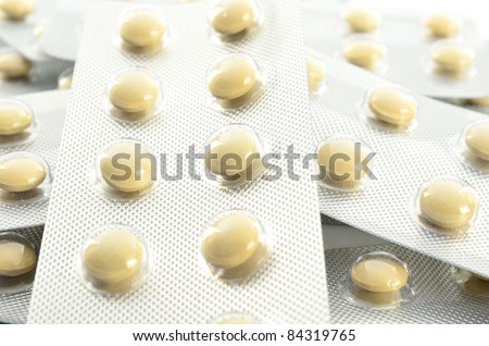 Pills in blister packs on white background