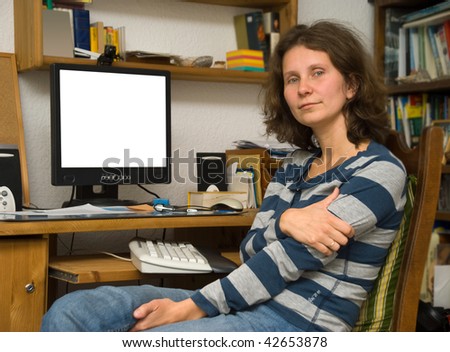 The woman at a computer in the room